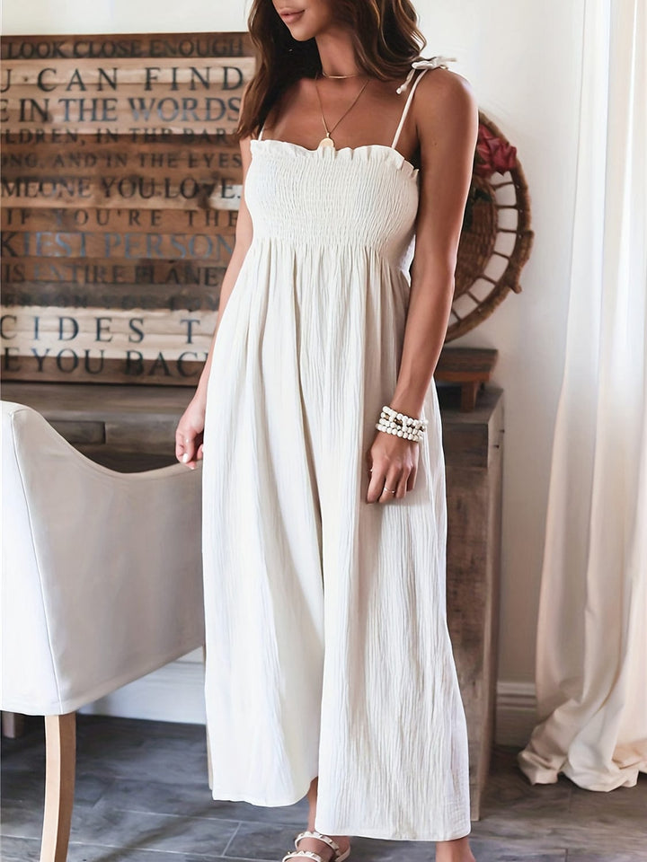 Camila - Elegant high-waisted monochrome sleeveless jumpsuit with cord pleats